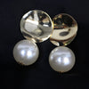 Elegant White Pearl Drop Earrings – Glossy Beads with Gold-Tone Abstract Tops