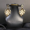 Statement Leaf Drop Earrings – Bold Gold-Tone Textured Design