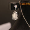 Elegant White Teardrop Pendant & Earrings Set – Silver Finish