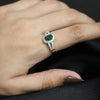 Emerald Sparkle Oval Ring – Silver Band with Halo Design